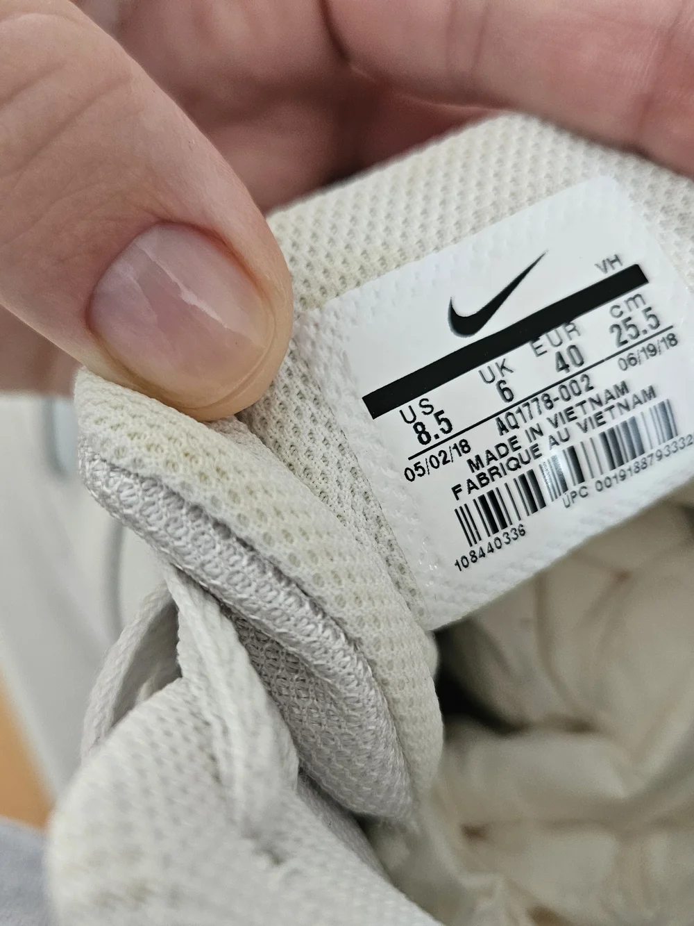 Nike Women's White Leather High-Top Sneakers with Grey Swoosh